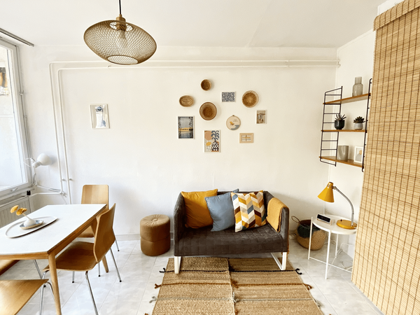 Karancs gas stove, herons, and wood paneling | See the Napsugár Retro Apartman after its makeover