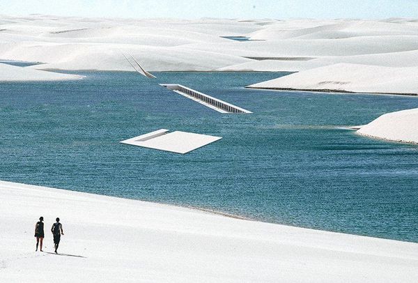 Minimalist living space embedded in water and sand for kite-surfers