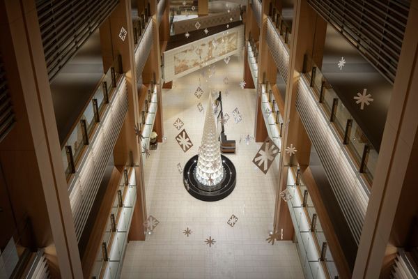 Paper snowflake-like elements make up this beautiful minimalist Christmas tree